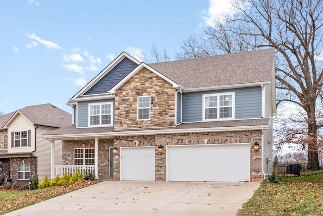 view of front of property with a porch and a garage