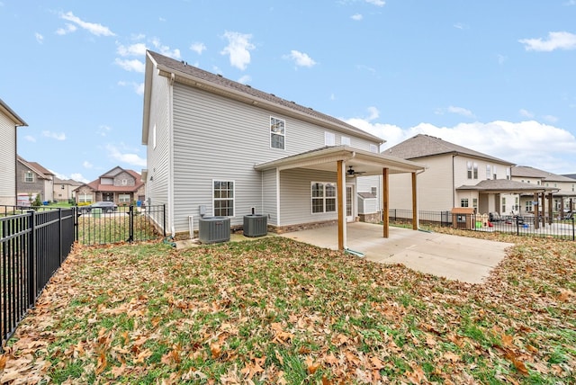 rear view of house with central AC unit, a patio, and ceiling fan