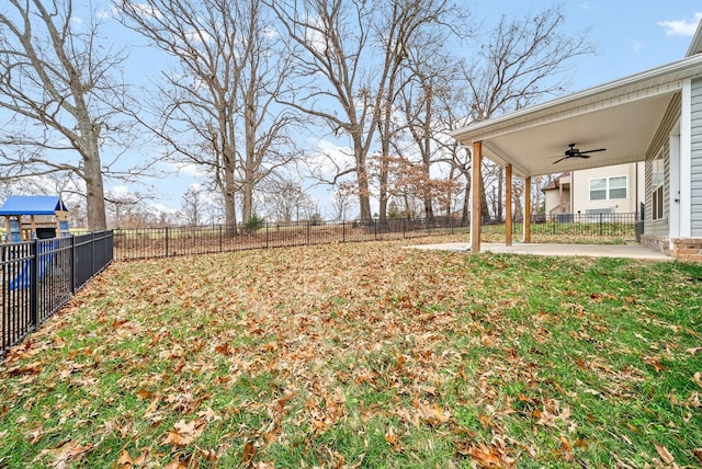 view of yard featuring a patio area and ceiling fan