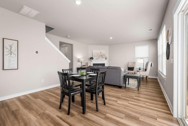 dining area featuring light wood-type flooring