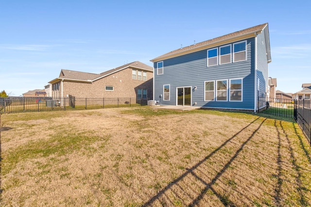 rear view of property with a yard, a patio area, and central air condition unit