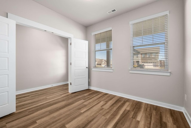 unfurnished bedroom featuring hardwood / wood-style floors