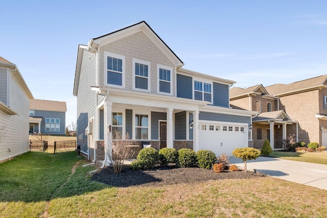 craftsman inspired home with a garage, covered porch, and a front lawn