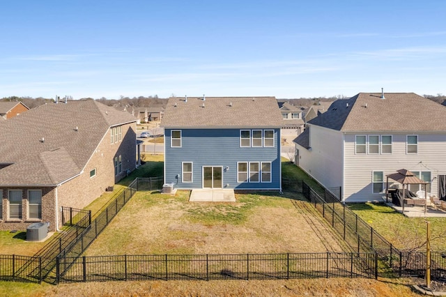 rear view of house with a patio, a lawn, and central air condition unit