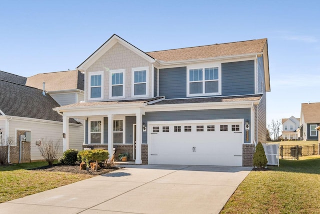 craftsman house featuring a garage, covered porch, and a front lawn