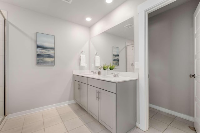 bathroom with vanity, tile patterned flooring, and walk in shower