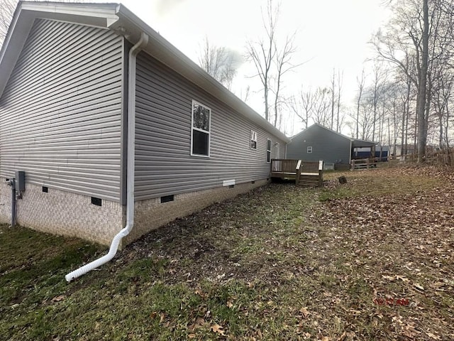 view of home's exterior with a deck