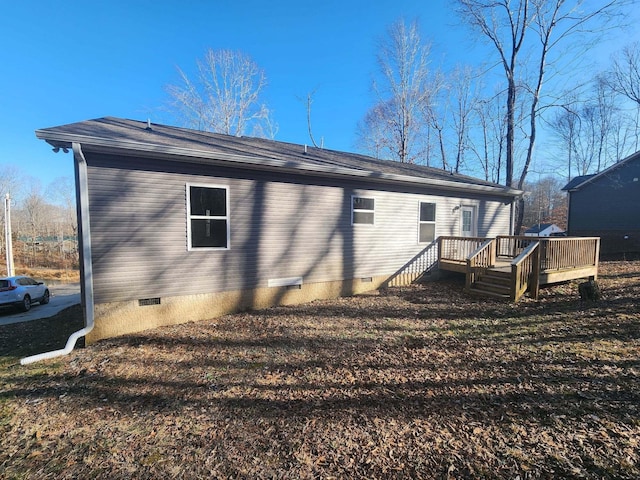 rear view of house with a deck