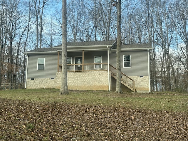 exterior space with a porch and a yard