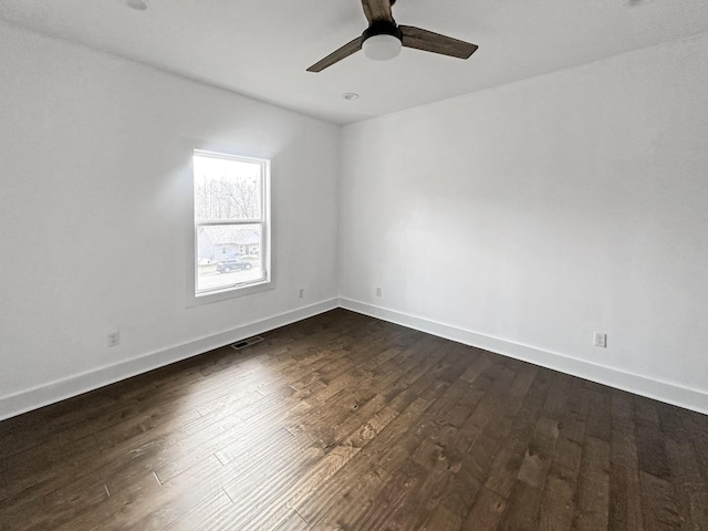 unfurnished room with ceiling fan and dark hardwood / wood-style floors