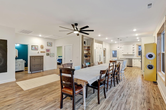 dining room with light hardwood / wood-style floors