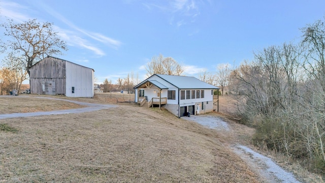 view of front of home with a sunroom