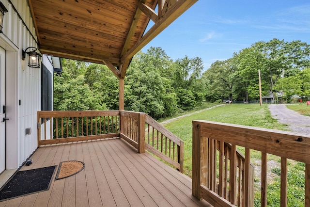 1157 Noah Reeves Rd, Ashland City, TN 37015 - wooden terrace with a lawn and view of wooded area