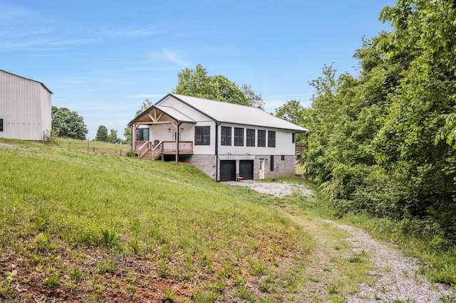 1157 Noah Reeves Rd, Ashland City, TN 37015 - back of house with a garage and driveway