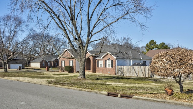 ranch-style house featuring a front lawn