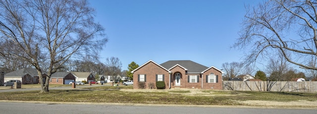 single story home with a front yard