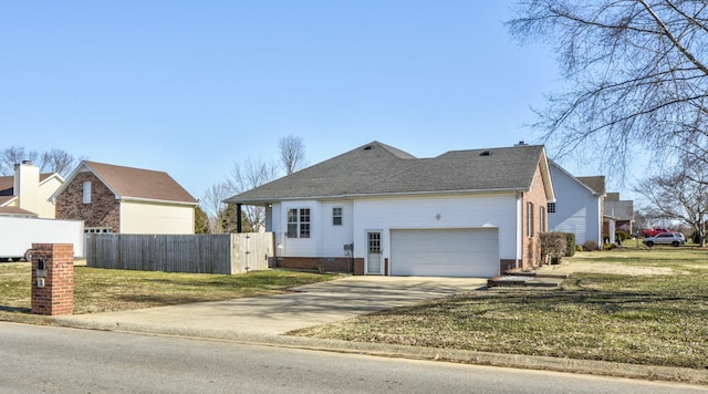 view of front of property featuring a garage and a front yard