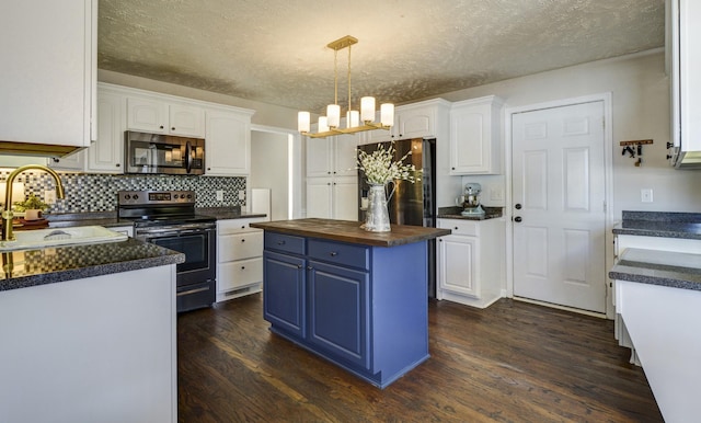 kitchen featuring sink, stainless steel appliances, and white cabinets