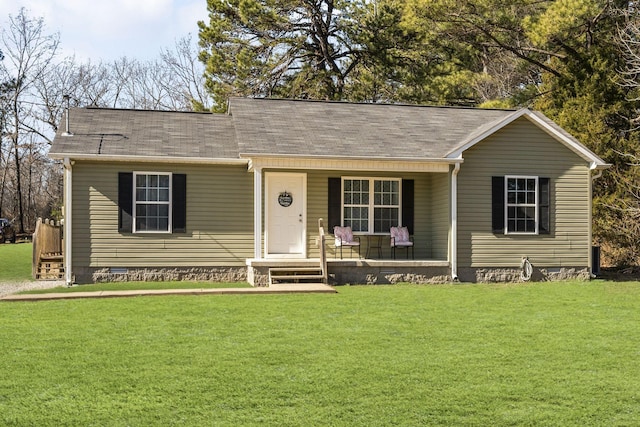 ranch-style house featuring a porch and a front yard