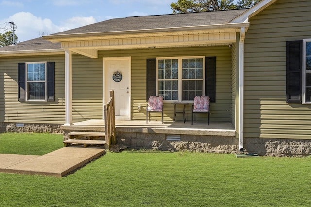 property entrance featuring a porch and a yard