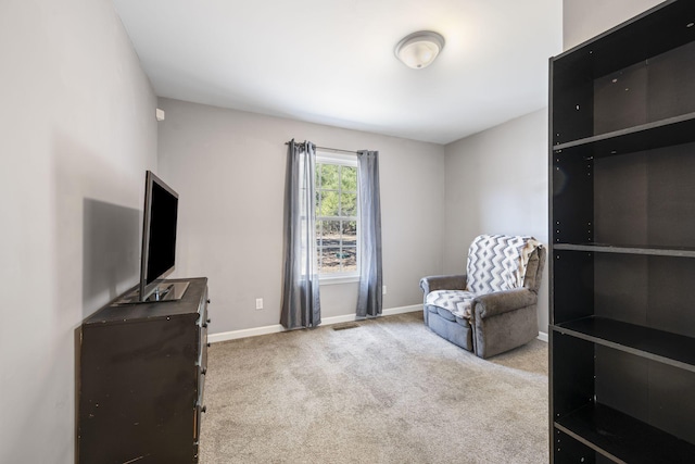 living area with light colored carpet