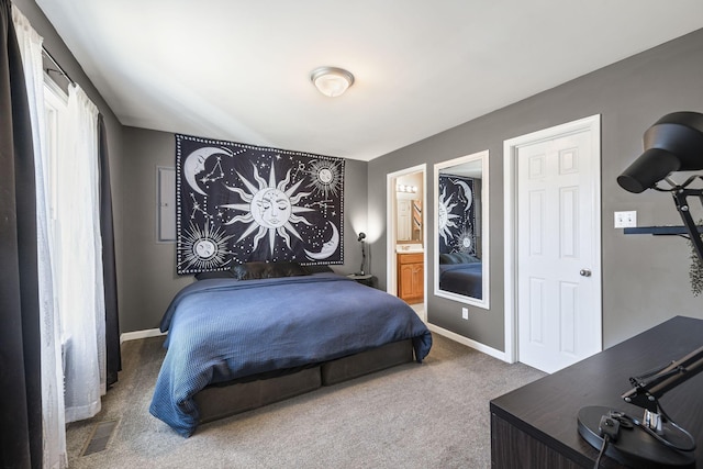 carpeted bedroom featuring ensuite bathroom