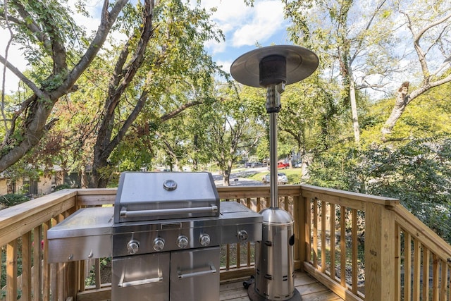 wooden deck with a grill