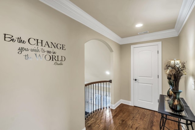 hallway featuring dark wood-type flooring and crown molding