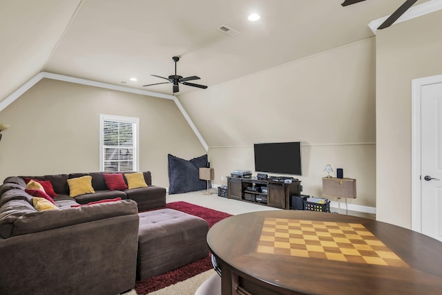 carpeted living room featuring ornamental molding, lofted ceiling, and ceiling fan