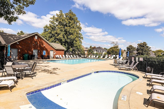 view of swimming pool with a patio