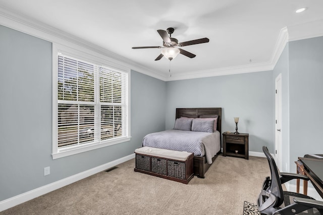 bedroom featuring crown molding, light colored carpet, and ceiling fan