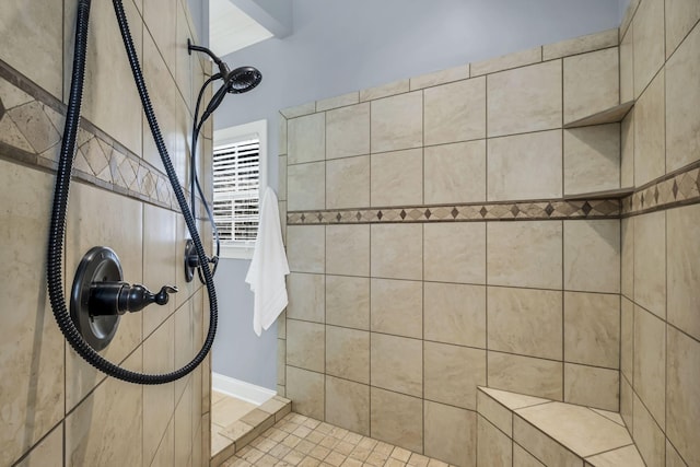 bathroom with tiled shower