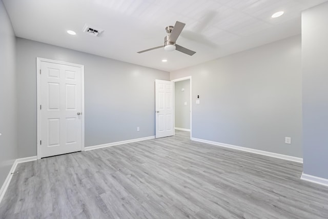 spare room featuring ceiling fan and light wood-type flooring