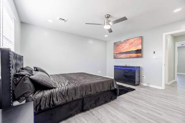 bedroom featuring ceiling fan and light wood-type flooring