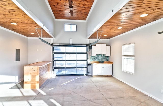 garage featuring wooden ceiling and electric panel