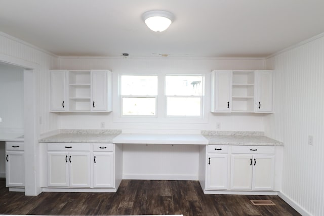 kitchen featuring white cabinetry and dark hardwood / wood-style flooring