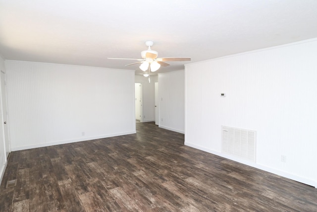 spare room featuring ceiling fan and dark hardwood / wood-style floors