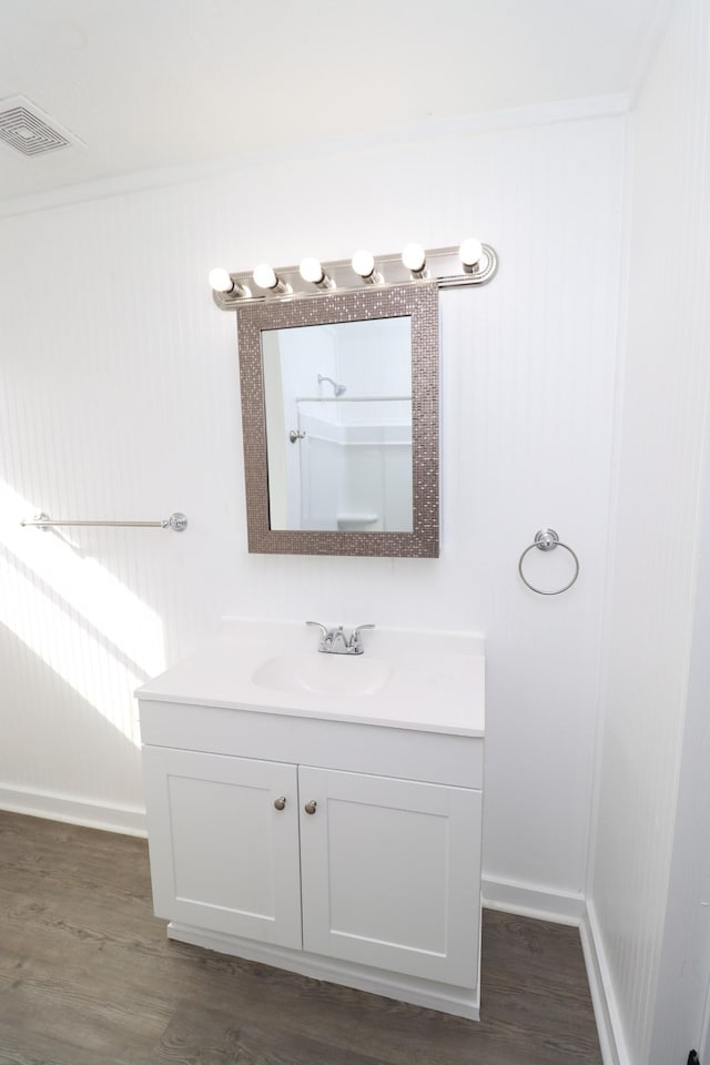 bathroom with hardwood / wood-style flooring and vanity