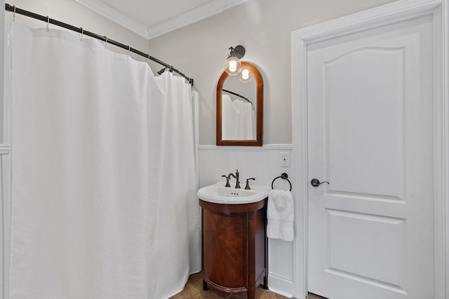 bathroom featuring crown molding and curtained shower