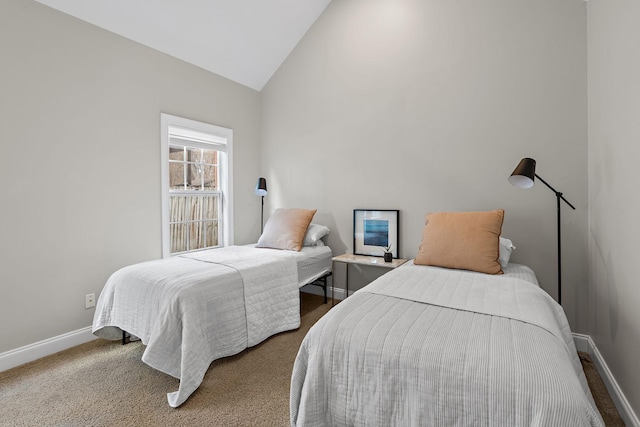 bedroom featuring vaulted ceiling and carpet