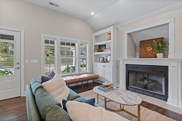 living room featuring vaulted ceiling and wood-type flooring