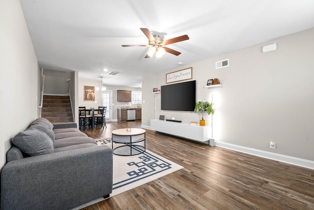 living room with dark hardwood / wood-style floors and ceiling fan