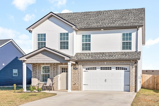 view of front of property with a garage and a front lawn