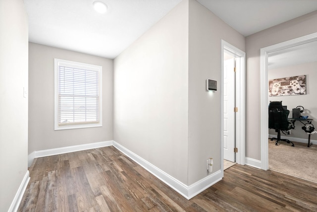 hallway featuring dark hardwood / wood-style floors