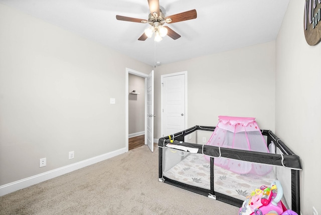 carpeted bedroom featuring ceiling fan