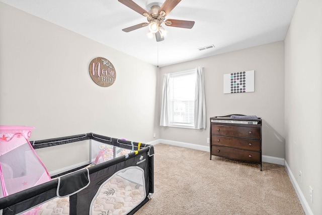 carpeted bedroom with ceiling fan