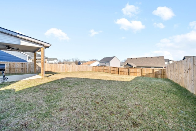 view of yard with ceiling fan