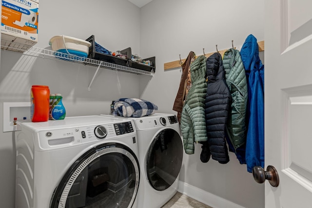 clothes washing area with washing machine and clothes dryer