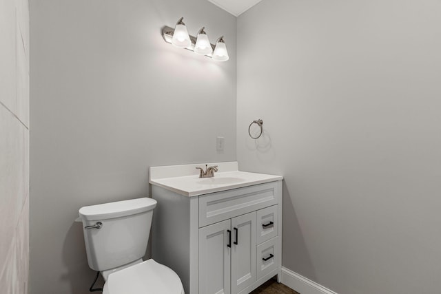 bathroom with vanity and toilet