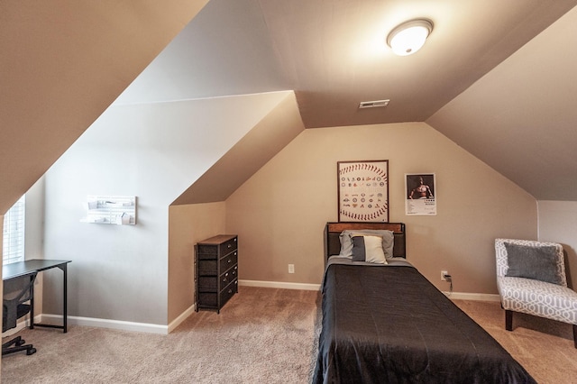 bedroom with lofted ceiling and carpet flooring